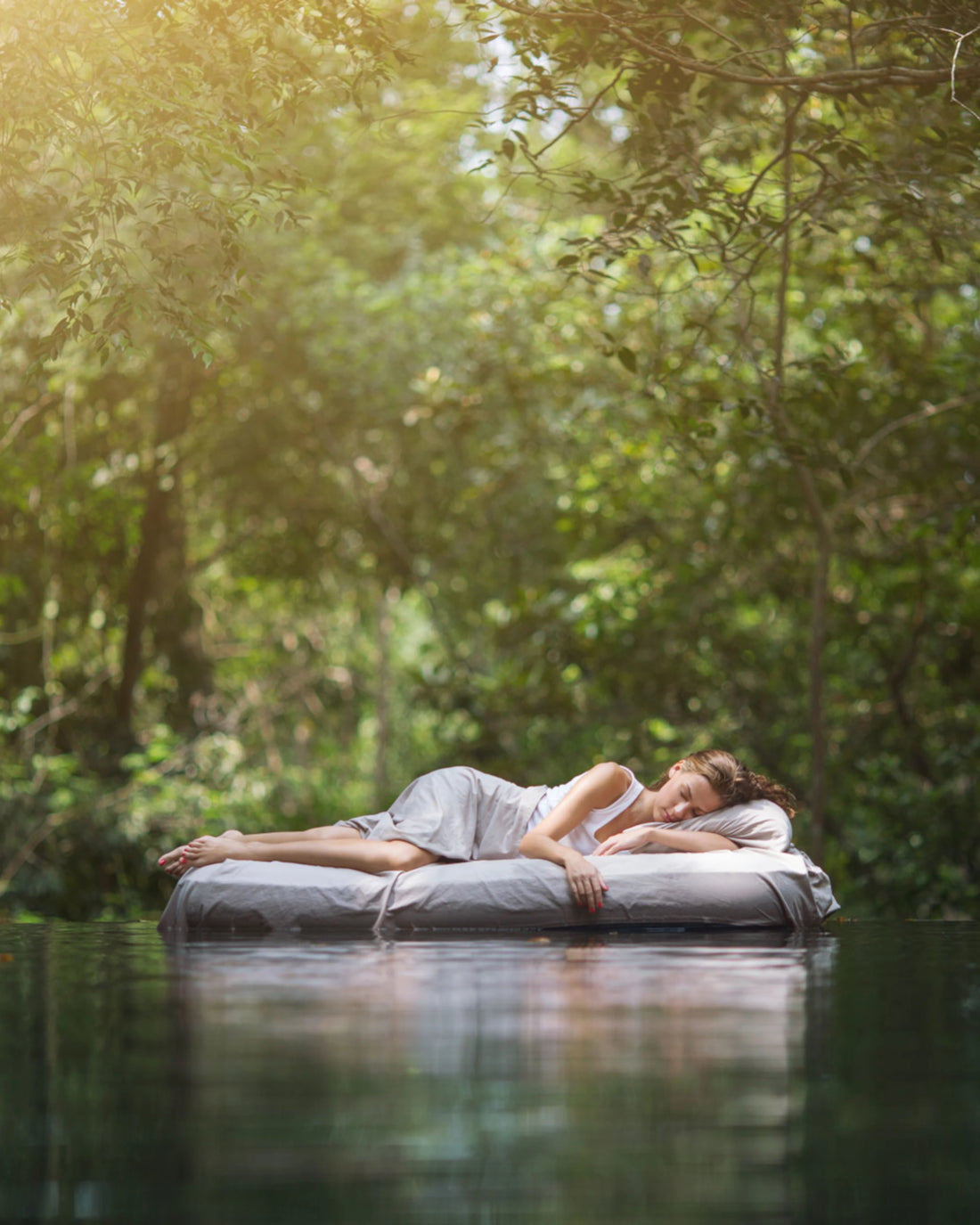 Sleeping-woman-in-bed-on-water